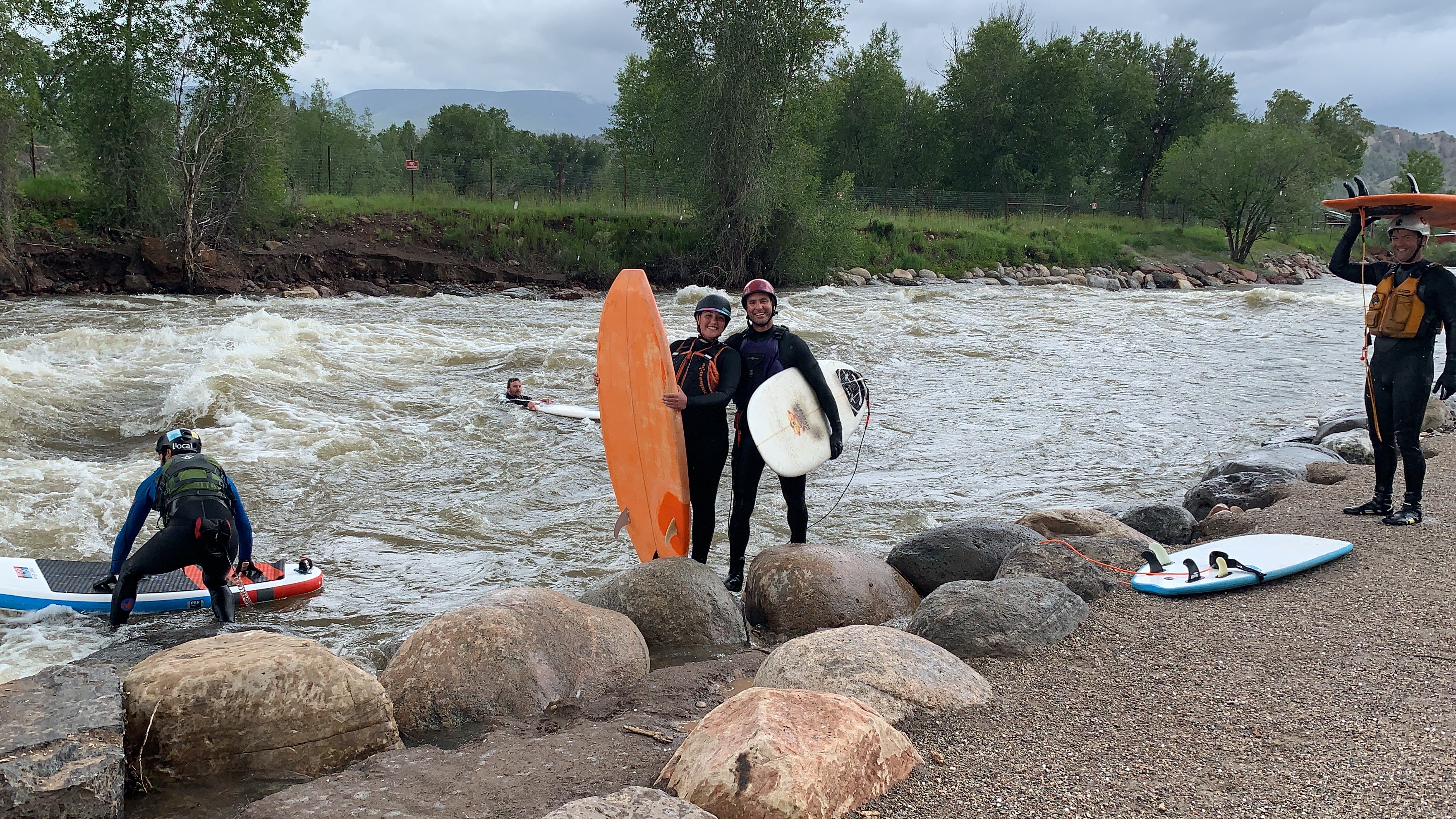 River-surf community gathered on the riverbank